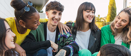 cheerful-group-of-diverse-friends-sitting-smallutc